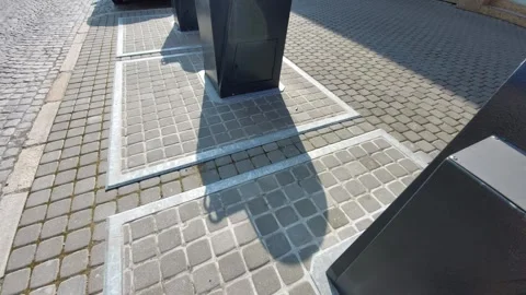 Modern underground garbage containers on a cobblestone street in a city Vídeo Stock 333642695