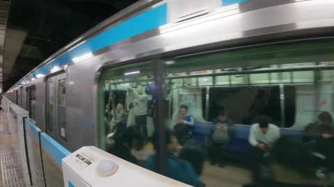 Modern underground metro train arriving at a station platform in Tokyo Stock-Footage 330263870
