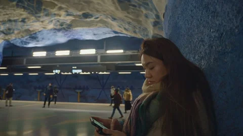 Modern Underground Station with Commuters Using Mobile Devices Stock Footage 335588553