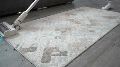 Modern upright cleaning appliance operating on patterned carpet surfaces Stock Footage 345023860