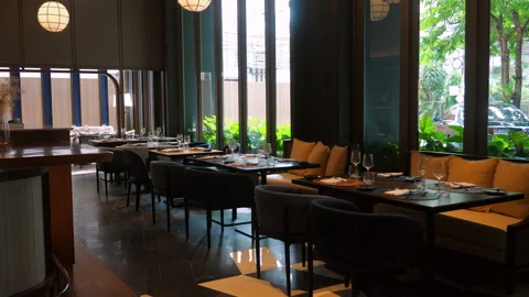 Modern upscale restaurant interior with elegant decor and large Stock Footage 281100298