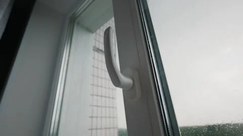Modern Upvc Window Handle and Glass Pane on Overcast Rainy Day Stock Footage 339175892