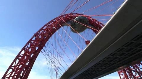 The modern urban car cable-stayed bridge over the river Stock Footage 51109611