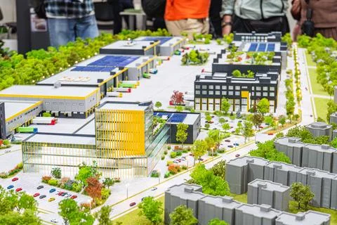 Modern urban development model cityscape featuring diverse buildings, green.. 库存照片