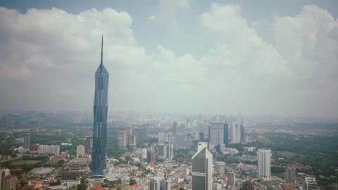 Modern Urban Landscape Featuring an Iconic Skyscraper Set Against a Cloudy Sky Stock Footage 318385602