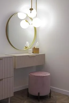 Modern vanity console with round mirror Stock Photos