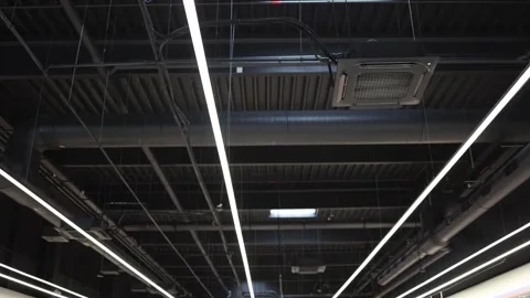 Modern ventilation and air conditioning system on an industrial ceiling Stock Footage 342914841