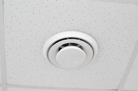 Modern ventilation built into the ceiling. Round ventilation duct Stock Photos