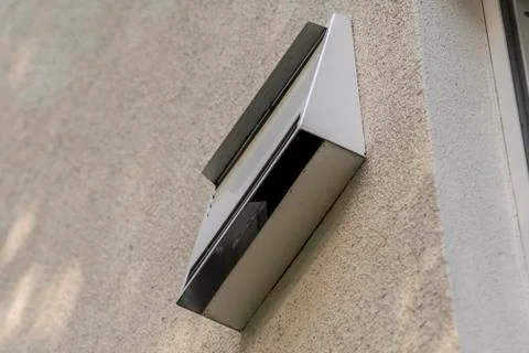 Modern ventilation system on the outer wall of a new house photographed from  Stock Photos