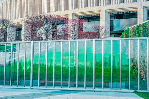 Modern version of the wall. Classical architecture. Glass fence. Reflection of Stock Photos