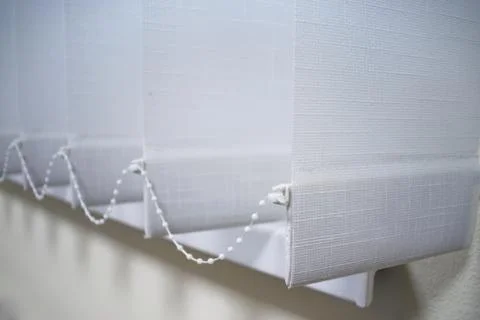 Modern vertical blinds on the window. Stock Photos