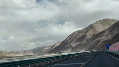 Modern Viaduct Highway and Mountain Tunnels on Karakoram Highway Xinjiang China Stock Footage 339830657