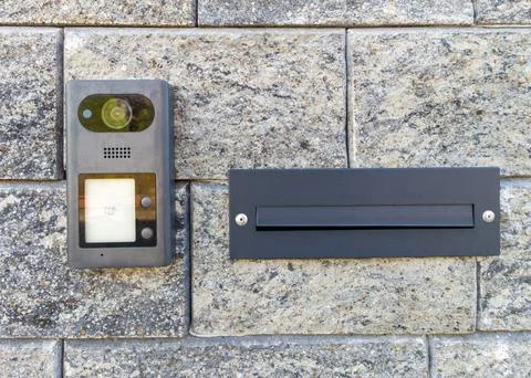 Modern video intercom and mailbox on brick wall Stock Photos
