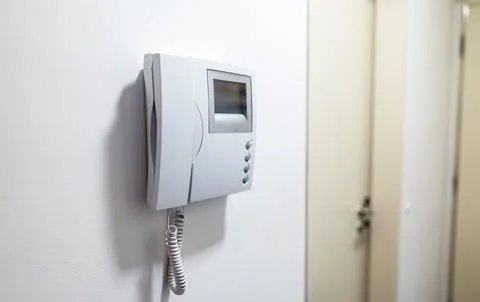 Modern Video Intercom System Mounted on white wall. Foto stock