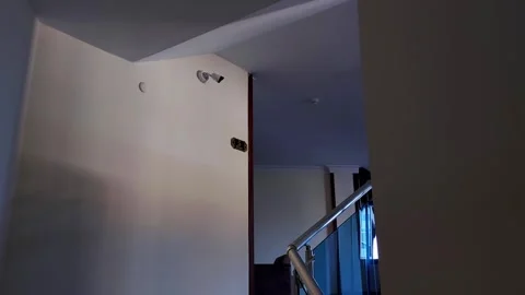 Modern video security camera on the wall indoors. Copy space for text Video stock 304111025