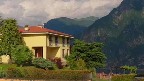 Modern Villa with Dramatic Mountain Background Stock Footage 331112424