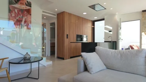 Modern villa interior with wood kitchen and cozy living area Stock Footage 324453242