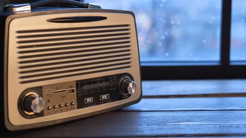 Modern vintage music player on the table by the window Stock Footage 122218853