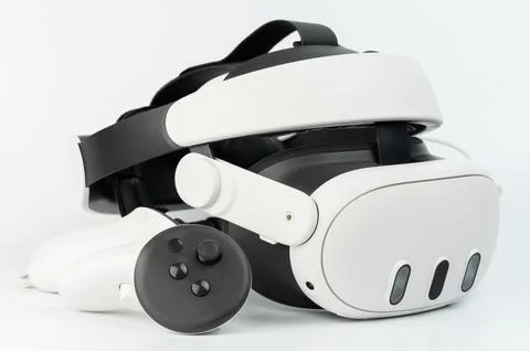 Modern VR headset and controller showcasing advanced technology on clean su.. 스톡 사진