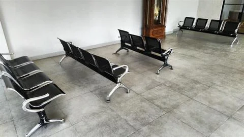 Modern Waiting Area with Rows of Black Chairs. Stock Photos