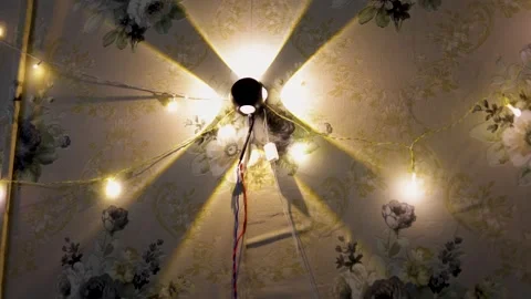 Modern Wall Light Casting Decorative Geometric Beam Pattern On Floral Wallpap Stock Footage 340462808