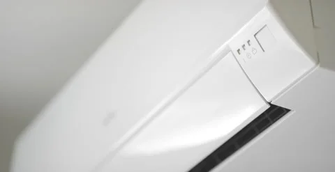 Modern wall mounted air conditioner in action, close-up 6K shot on Red Stock Footage 130871062