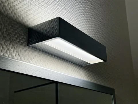 Modern Wall Mounted LED Light Fixture in Contemporary Interior Design Stock Photos