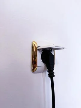Modern Wall Socket with Plug Inserted and Protective Cover Stock Photos