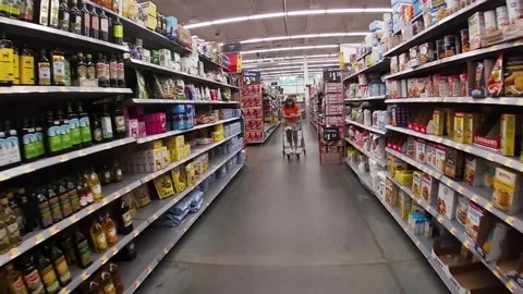 Modern Walmart grocery store interior slow motion POV walking by customer Stock Footage 184608677
