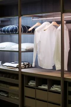 A modern wardrobe room with lighting, with examples of shelves for clothes in Stock Photos