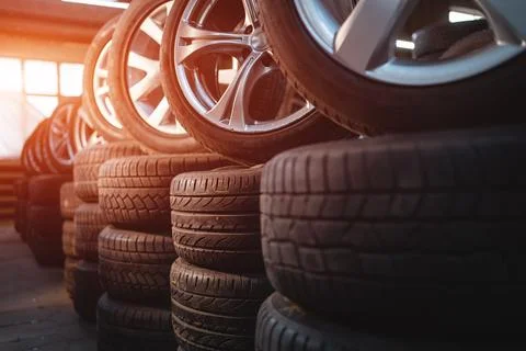 Modern warehouse with stack of car tires Stock Photos