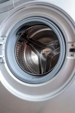 Modern washing machine drum interior, close-up view. Stainless steel drum, .. Stock Photos