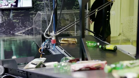 Modern waste sorting with a mechanical manipulator. Stock Footage 194262108