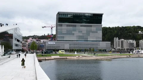 Modern waterfront scene oslo angular glass and steel munch museum beside calm Stock Footage 327632749