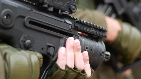 Modern weapon in sildiers arms Stock Footage 79340912
