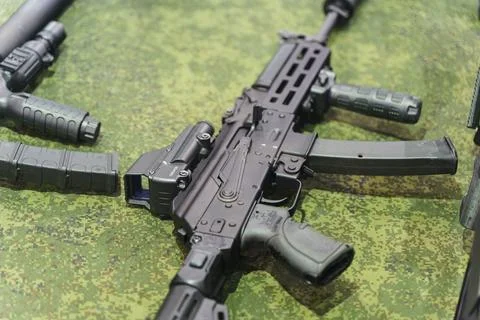 Modern weapons automatic rifles and machine gun on the counter. Firearms for the Stock Photos