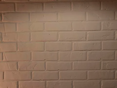 Modern white brick wall texture for background. Warm light yellow Stock Photos