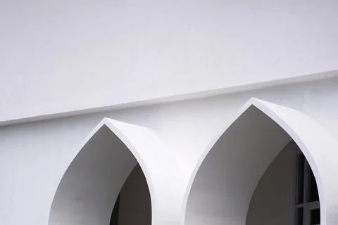 Modern white building with elegant pointed arches Stock Photos