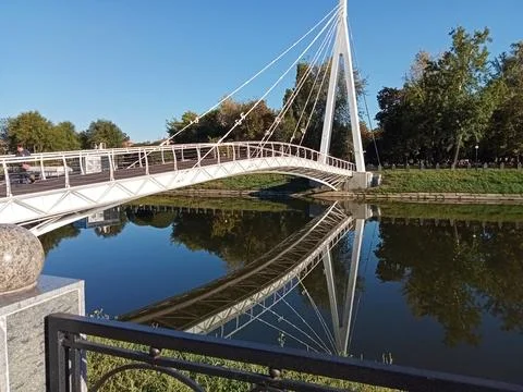 Modern White Cable Bridge Over Calm River With Reflection Stock Photos