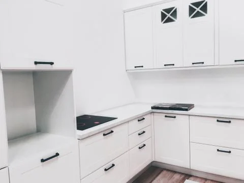 Modern white colored kitchen interior Stock Photos