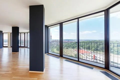 Modern white empty loft apartment interior with parquet floor and panoramic w Stock Photos