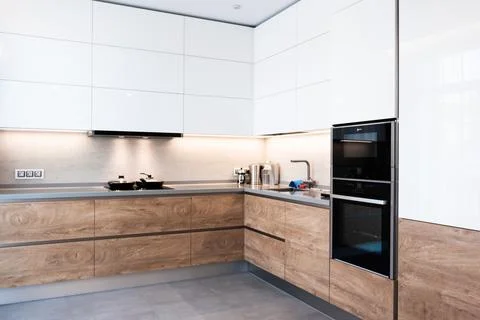 Modern white kitchen clean interior design. Home cooking Stock Photos