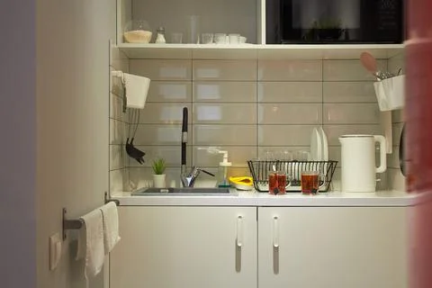 Modern white kitchen clean interior design. The kitchen has everything you ne Stock Photos