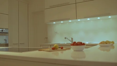 Modern white kitchen design and modern kitchen quartz counter top with cooktop Vídeos de archivo 114317394