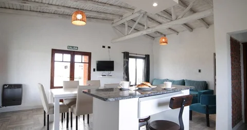 Modern white kitchen, dinning and living room with breakfast 스톡 동영상 98034686