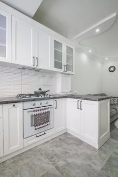 Modern white kitchen interior, front view Stock Photos