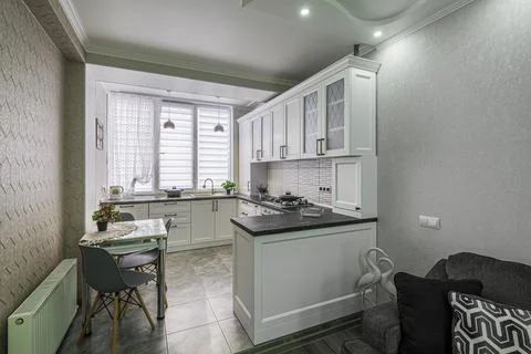 Modern white kitchen interior, front view Stock Photos