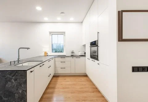 Modern White Kitchen Interior with Sleek Design and Contemporary Decor Stock Photos