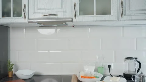 Modern White Kitchen Interior with Stylish Cabinets and Glossy Tile Backsplash Stock Footage 305607997