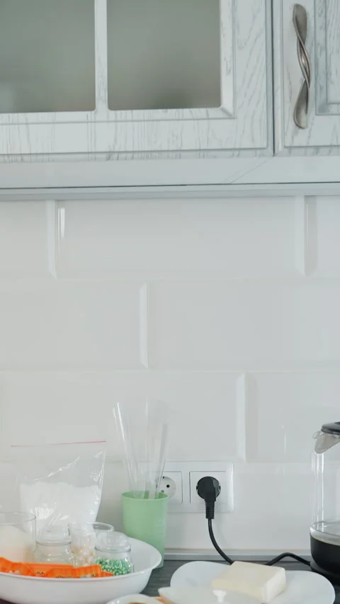 Modern White Kitchen Interior with Stylish Cabinets and Glossy Tile Backsplash Stock Footage 320336930
